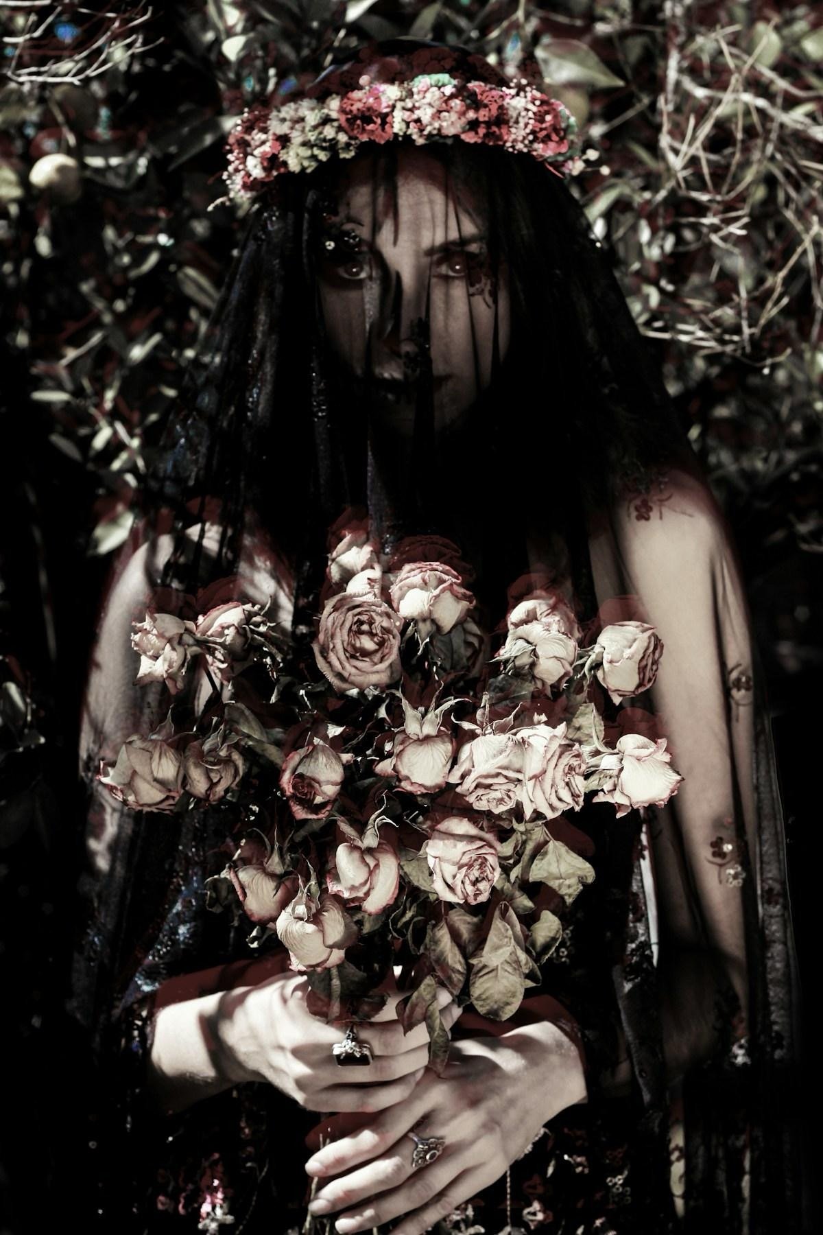 Save a Life Dramatic b&w photo of a woman holding a bouquet of flowers - Handy Entertainment